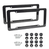 A set of black carbon fiber style license plate frames and mounting screws.