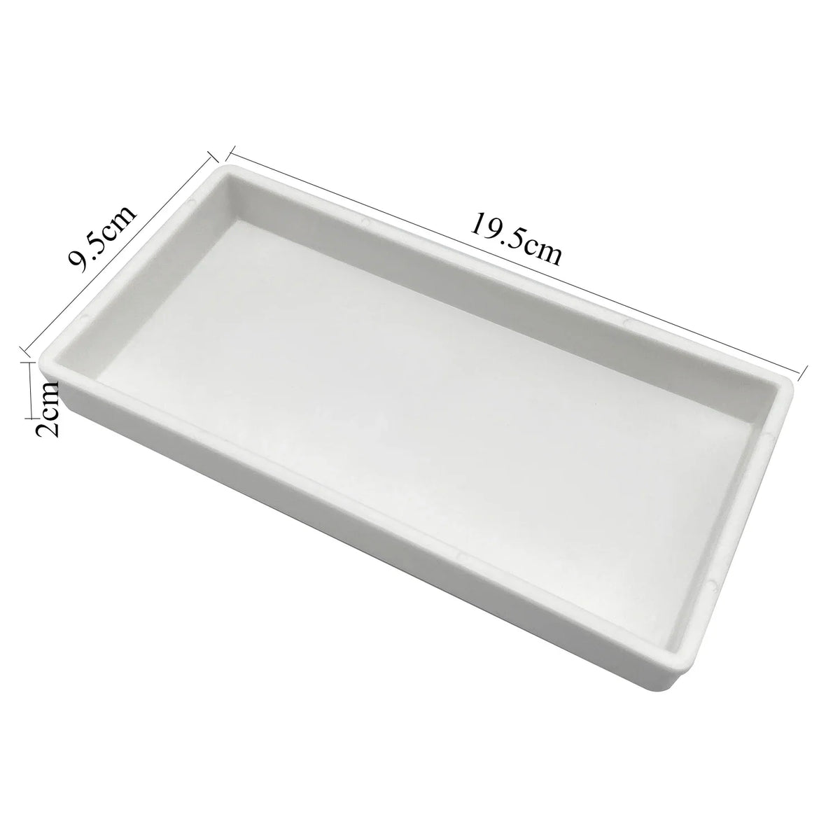 White plastic drawer organizer tray with dimensions 9.5cm by 19.5cm and a depth of 2cm.