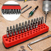 A red magnetic screwdriver bit holder rack with multiple screwdriver bits and a separate screwdriver is shown on a wooden sur