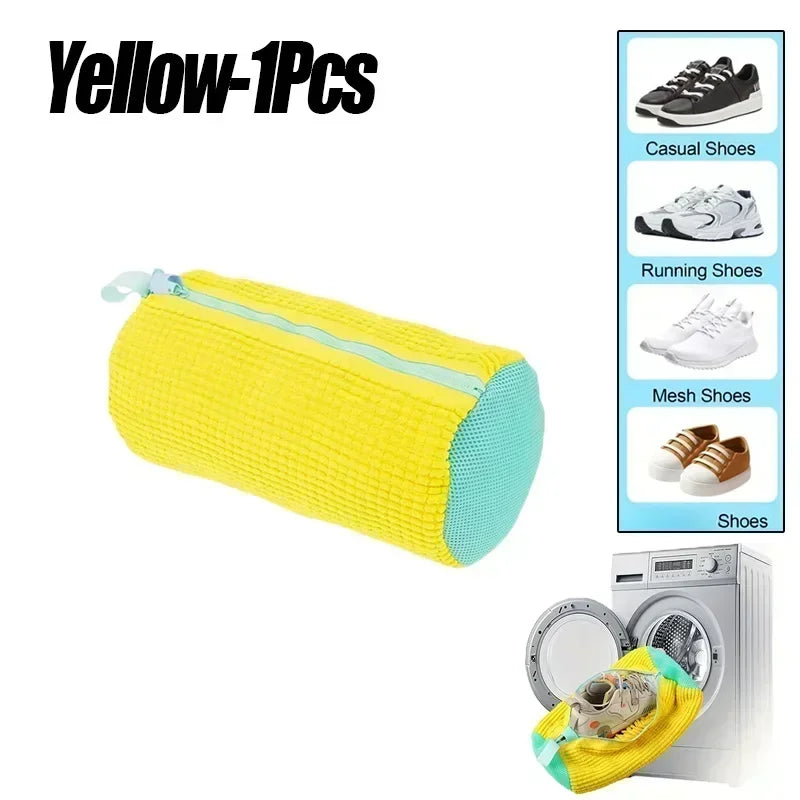 Yellow reusable shoe laundry bag with a zipper shown next to a washing machine.