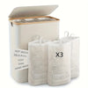 A beige foldable laundry hamper with a lid and three removable mesh bags shown next to it.