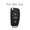 Black protective TPU key fob cover for an Audi flip key.