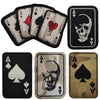 An embroidered patch featuring an ace of spades and a skull design with hook and loop backing.