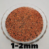 A close-up view of reddish-brown decorative stone pebbles measuring 1-2mm.