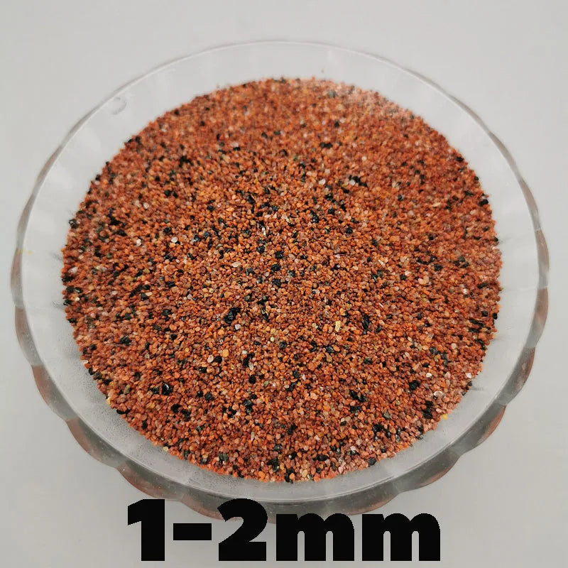A close-up view of reddish-brown decorative stone pebbles measuring 1-2mm.