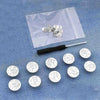 A clear plastic bag contains a set of silver instant no-sew snap button kits for loose jeans.
