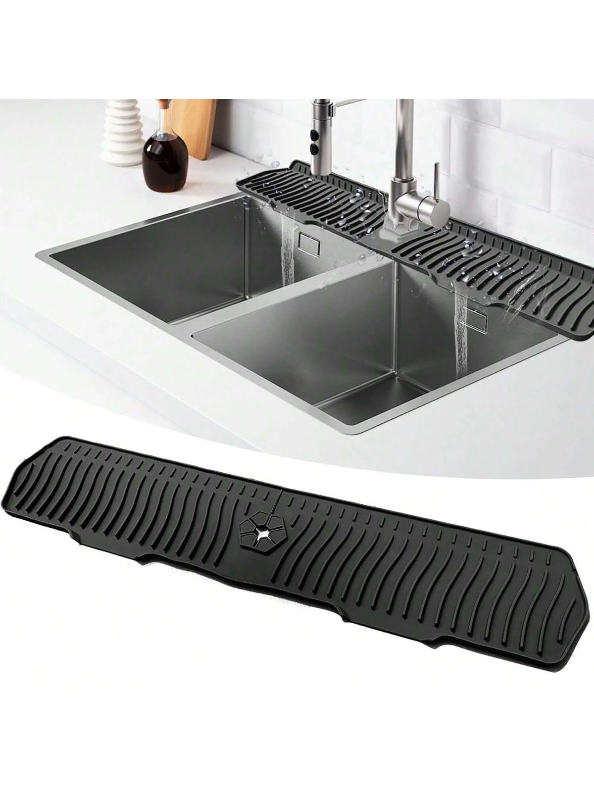 Black silicone faucet mat and sink splash guard placed over a stainless steel kitchen sink.