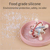 Pink silicone sensory rattle ball with attached rings for baby development