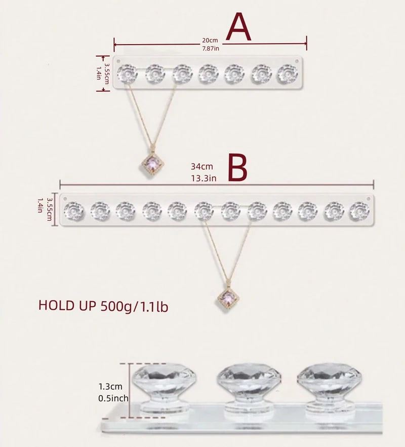 Two wall-mounted acrylic jewelry organizers displaying various crystal and diamond-shaped knobs.