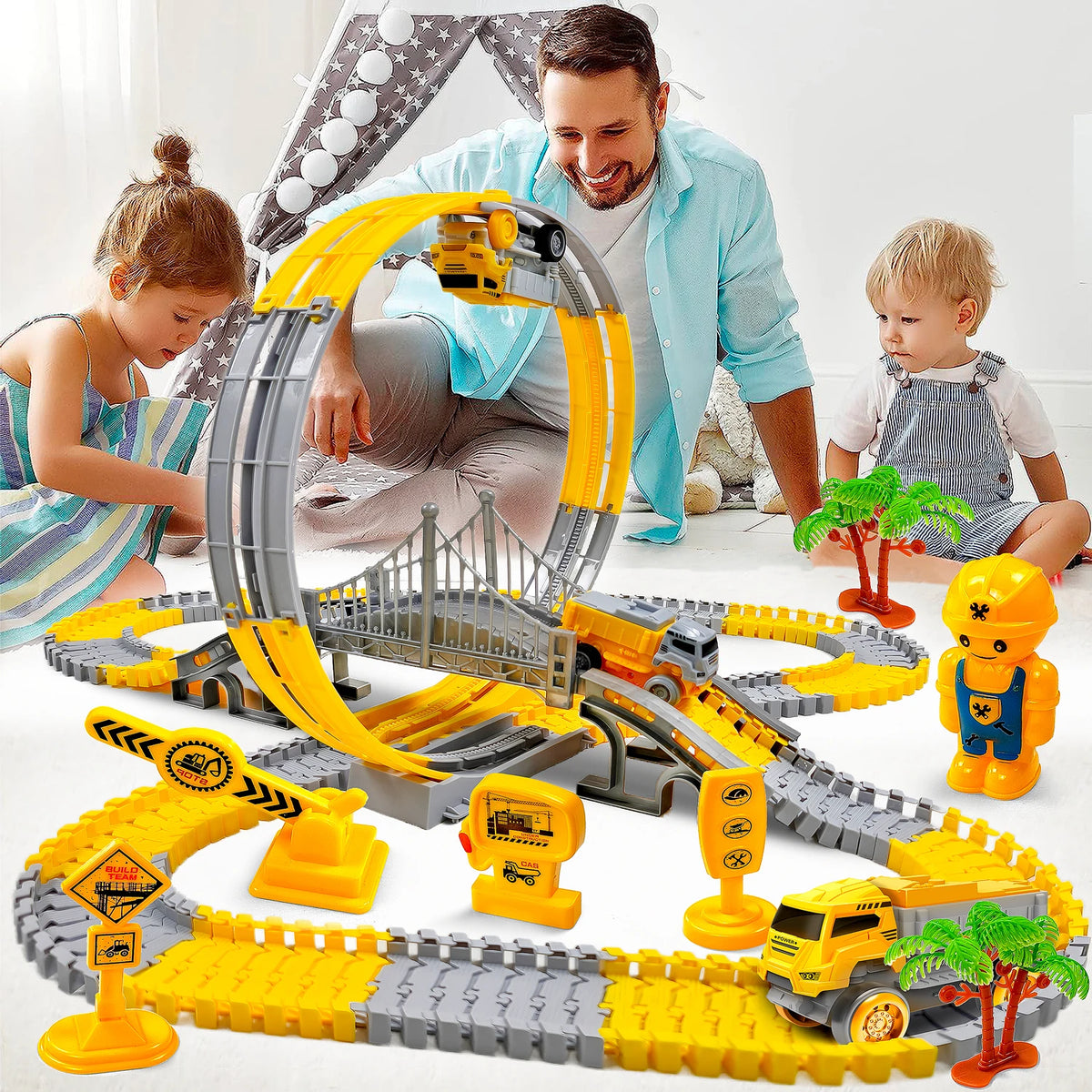 A man and a girl interact with an orange and gray climbing track car toy set on a white floor.