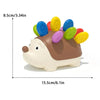 A sensory toy shaped like a hedgehog with colorful buttons for toddlers