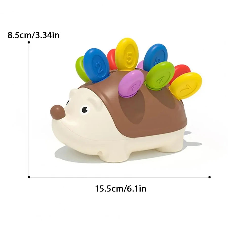 A sensory toy shaped like a hedgehog with colorful buttons for toddlers