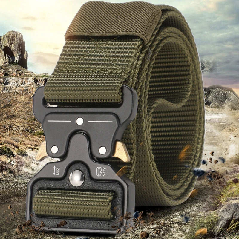 A close-up of a dark olive green tactical nylon belt with a secure metal buckle lying on rocky terrain.