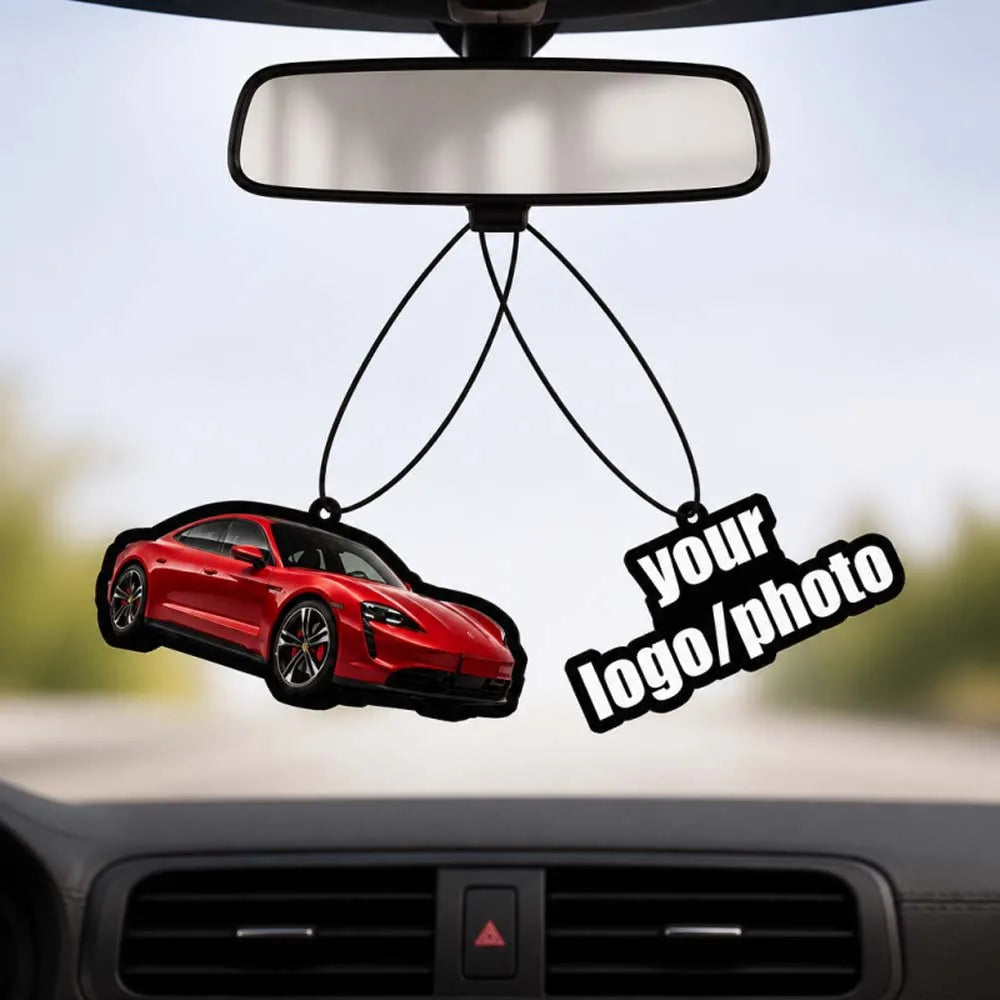 A custom photo car air freshener hangs from a rearview mirror, featuring a red car silhouette and a logo.