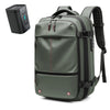 A dark olive green expandable travel laptop backpack with black straps and a separate vacuum compression device.