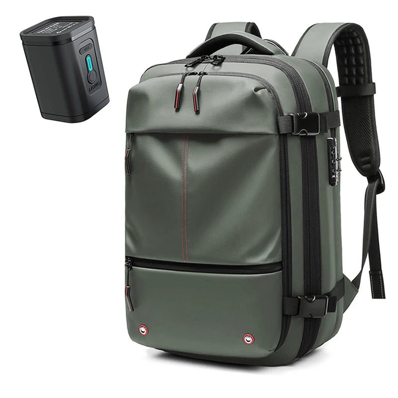 A dark olive green expandable travel laptop backpack with black straps and a separate vacuum compression device.