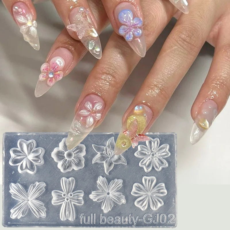 A hand displays floral silicone nail art molds featuring various flower shapes and petals.
