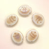 Five handcrafted ceramic fish beads showing natural variations in color and pattern