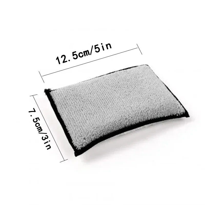 A rectangular gray microfiber scrub sponge with dimensions of 12.5cm/5in and 7.5cm/3in.