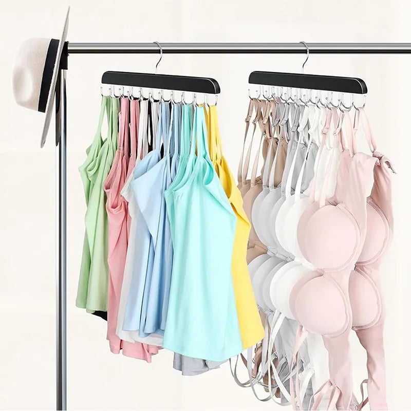 A wooden hanging organizer rack displaying various colorful belts, hats, and accessories on a clothes rack.