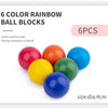 Six colorful rainbow ball blocks made of solid wood, with a blue block in the foreground.