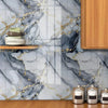 Marble effect peel-and-stick wallpaper featuring gray marble patterns with gold veining on a tile surface.