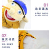 Close-up of a yellow plush hand puppet resembling Jeffy, showing its facial features and texture.