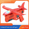 Red foam aircraft gun with light plate and wings, ready for catapult launch.