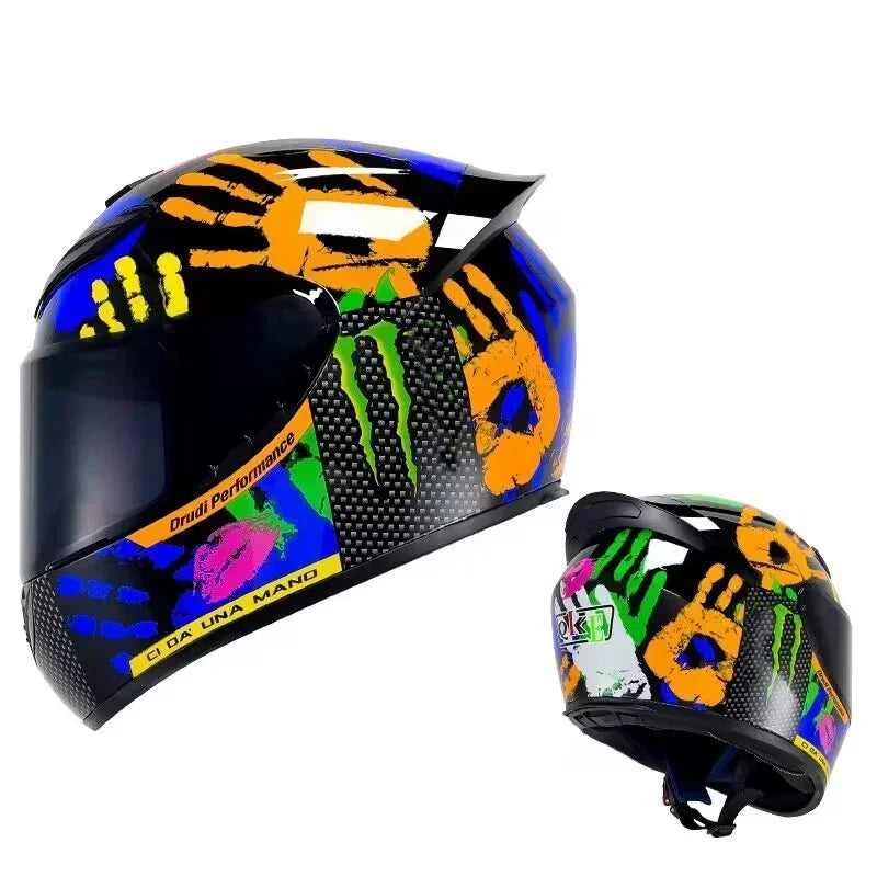 A black motorcycle helmet featuring a vibrant graphic design with yellow and green handprints.