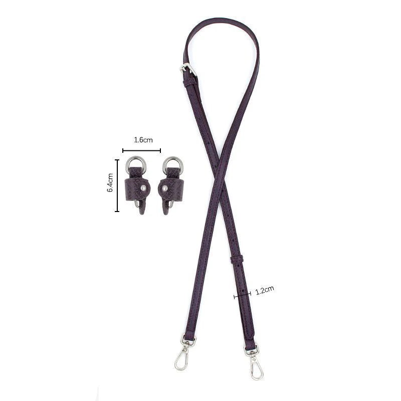 A dark purple leather shoulder strap with adjustable buckles and loops.