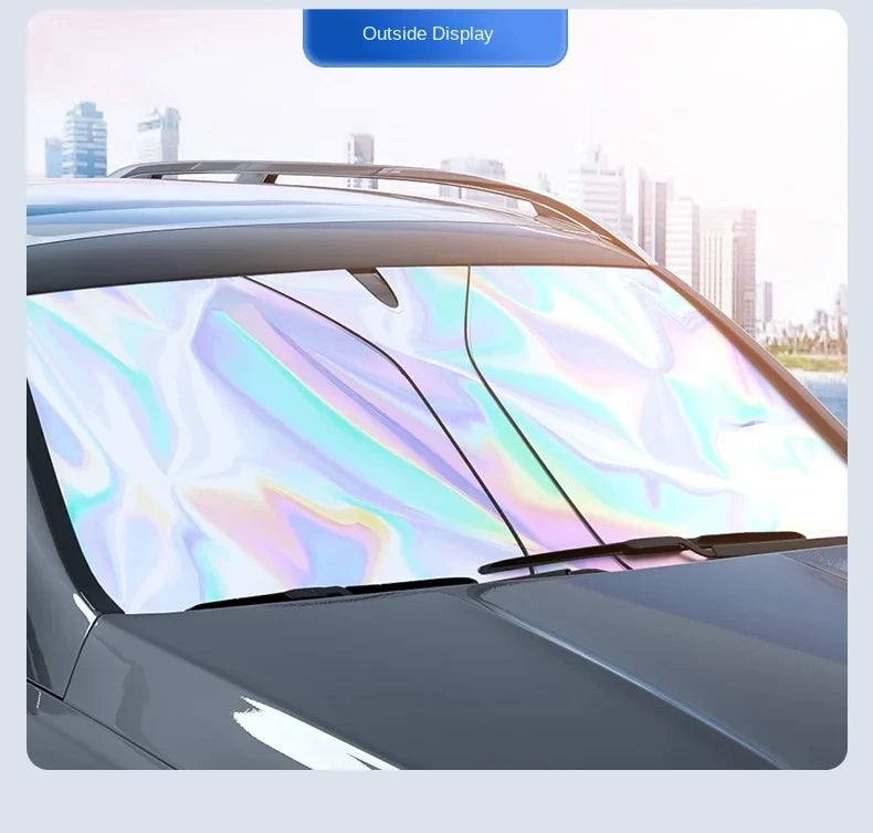 A car sunshade is shown installed on a vehicle's windshield, reflecting colorful light.