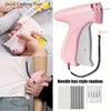 A pink mini sewing gun with a needle box style random set of needles and fasteners for fabric repairs