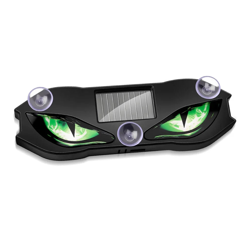 A black solar-powered devil eye LED rear window warning light with green accents and a solar panel.