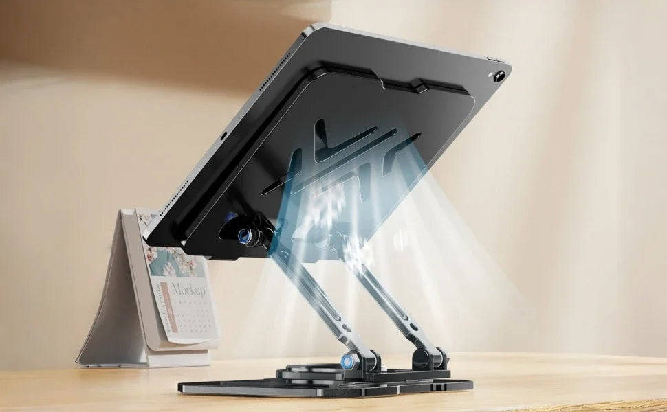 A black 360° rotating carbon steel tablet stand is shown on a wooden desk.
