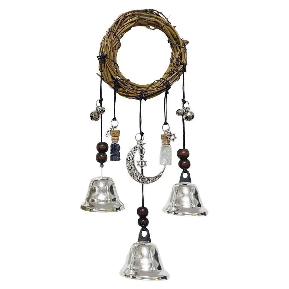 A rustic witch bells door hanger wind chime made of woven branches and hanging metal bells.