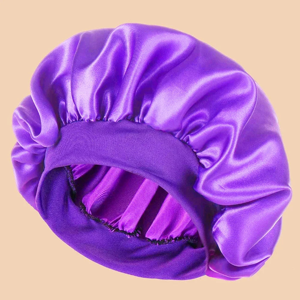 A purple satin wide brim shower cap is shown in a close-up view.