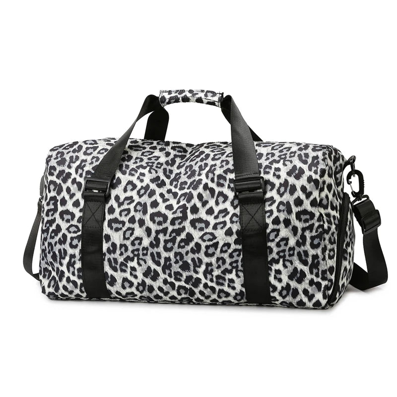 A black and white leopard print travel tote bag with handles and a shoe compartment.