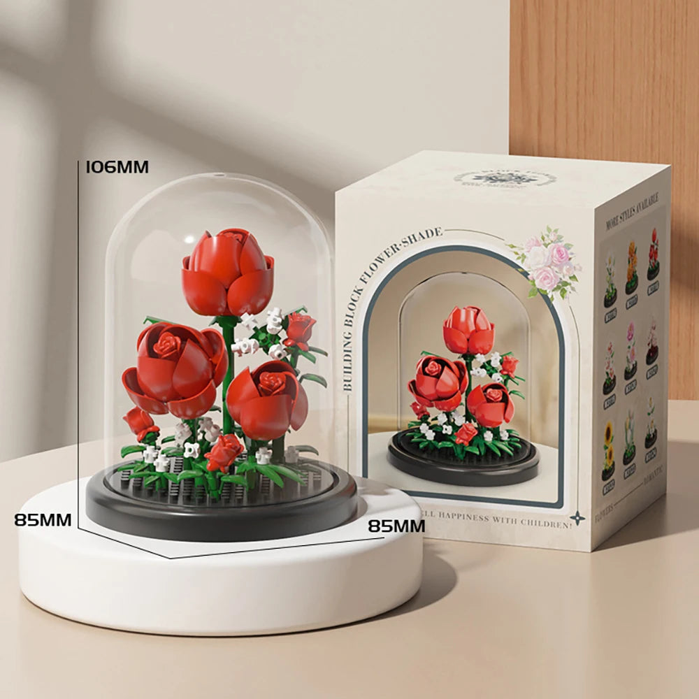 A white electric flower-shade model of a red rose bouquet built with black building blocks.