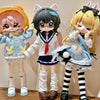 Three anime-style articulated blind box figurines with pink, black, and blonde hair wearing school uniforms