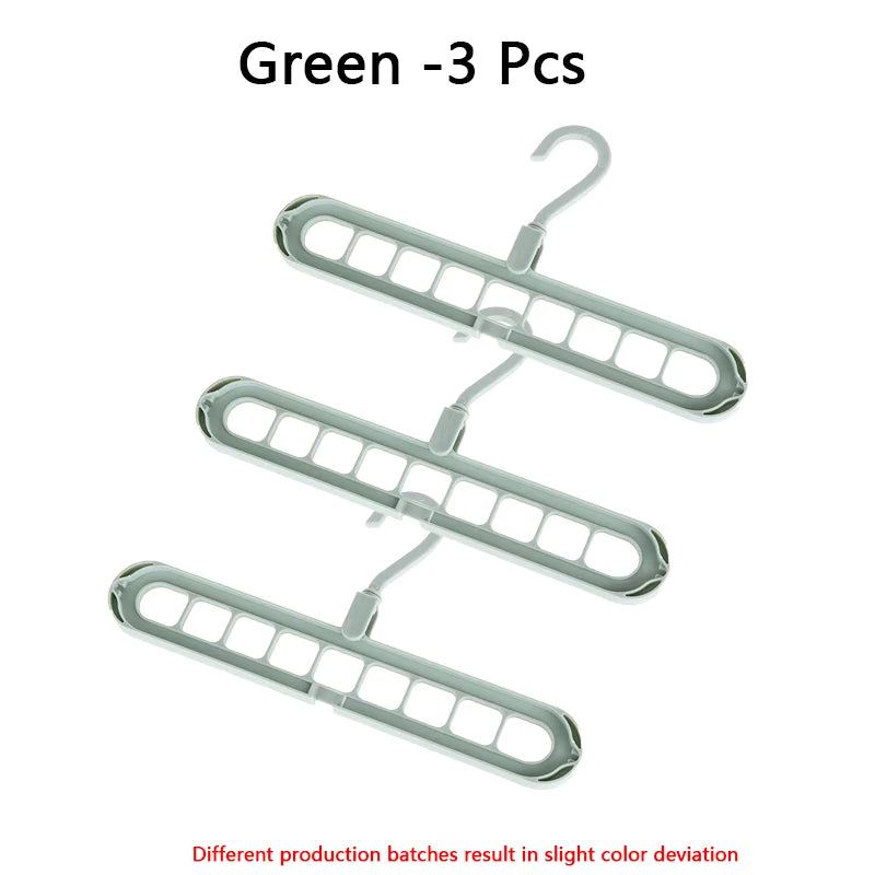 Set of three green folding hangers with 9 holes each