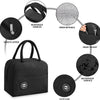 Black insulated lunch bag with reinforced handles, inner wipe, front pocket, waterproof surface, and cute icon.