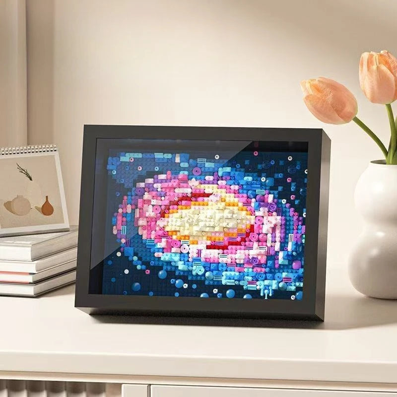 A framed artwork made of colorful diamond building blocks depicting a stylized starry night scene.