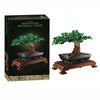 A box set of Bonsai Tree building blocks featuring a miniature tree in a pot on a wooden stand.