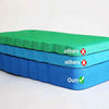 A stack of green and blue foam kneeling pads, labeled others and ours.
