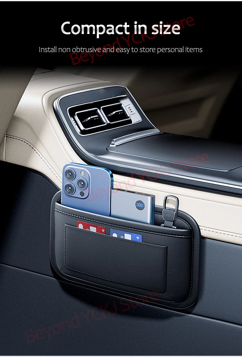 A black organizer bag with a clear window is placed in the side pocket of a car door, holding several smartphones.