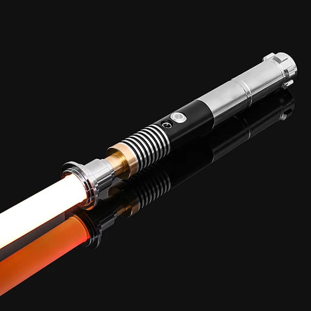 An RGB metal lightsaber with a black and silver hilt and an orange blade is shown against a dark background.