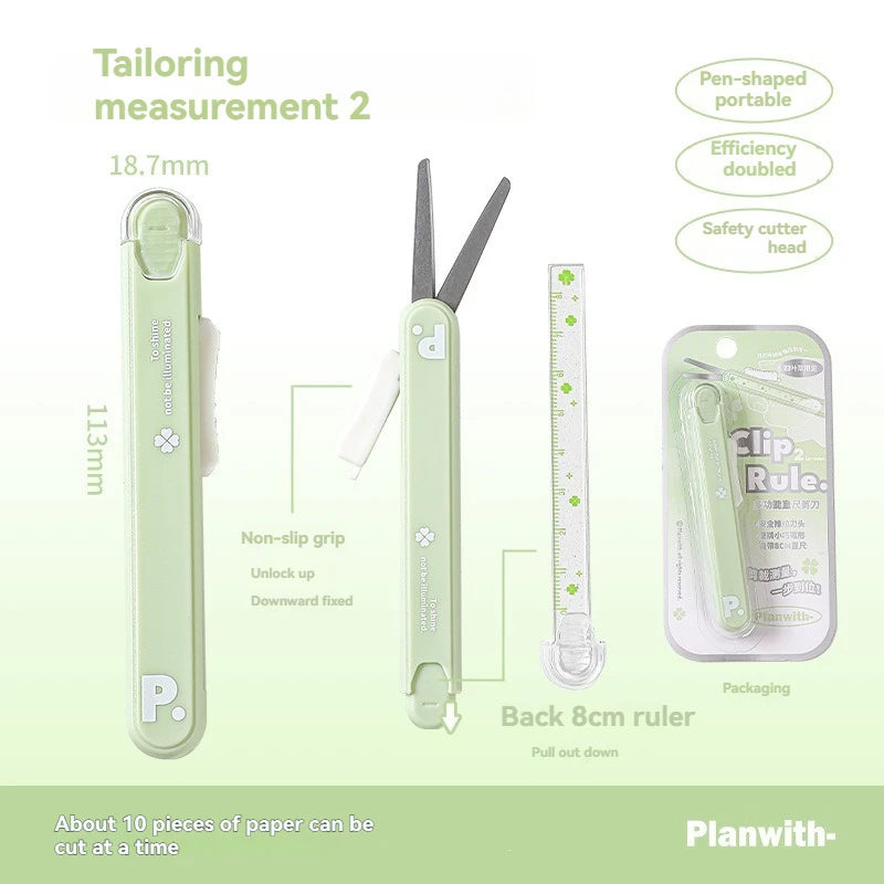 A light green pen-shaped measuring tool with a detachable cutter and ruler, shown next to its packaging.