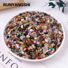 A bowl filled with mixed natural crystal gravel stones and gemstone chips for home decor and meditation.