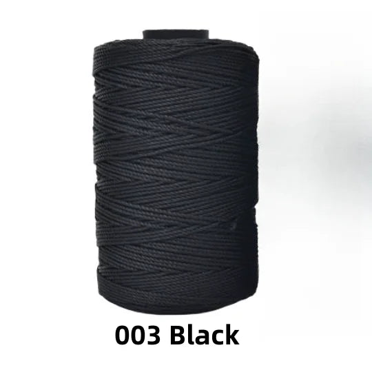 A spool of black ice silk crochet yarn for knitting and DIY crafts.