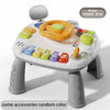 A white baby interactive activity table featuring a piano and steering wheel for learning